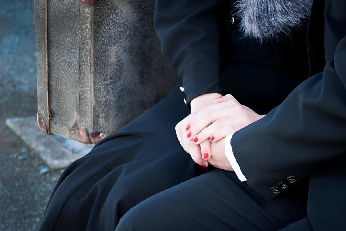 midsection-couple-suit-sitting-outdoors